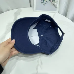 Detailed interior view of a navy blue baseball cap showing its inner tag and lining