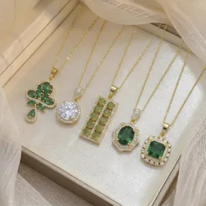 Detailed collection of gold necklaces with emerald green zircon pendants in elegant shapes
