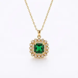 Detail shot of elegant emerald green zircon pendant necklace with double halo stones