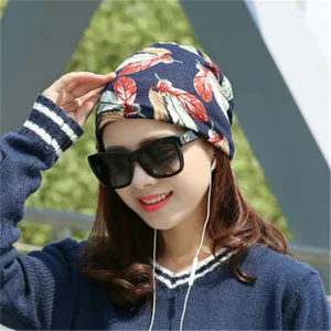 Comfortable navy blue beanie hat with vibrant feather pattern for stylish men and women