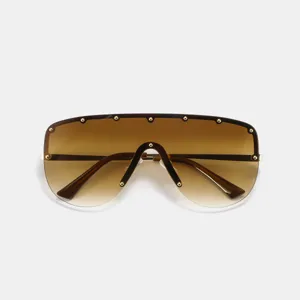 Lunettes de soleil punk sans monture avec rivets dorés et verres dégradés marron