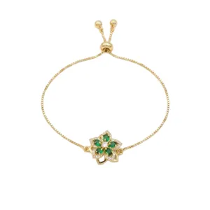 Bracelet doré ajustable avec un pendentif fleur rotatif vert émeraude