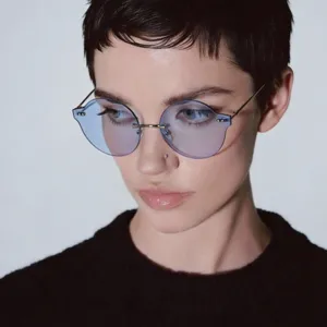Retro Y2K rimless round sunglasses with candy blue lenses and silver metal temples