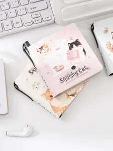 Cute pocket notebook with cat illustration and pen holder, ideal for student notes and journaling.