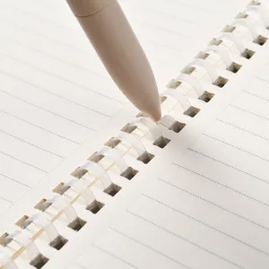 Soft spiral notebook with lined paper and matching pen, perfect for daily office and school notes.