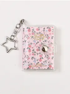 Transparent PVC mini binder notebook with floral pattern and star keychain for portable use.