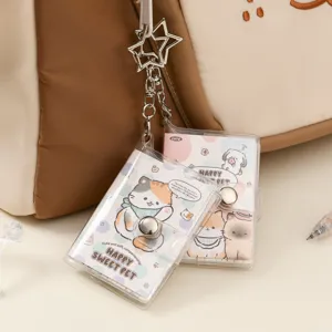 Mini cute clear PVC binder notebook keychain with adorable cat illustrations for bags.