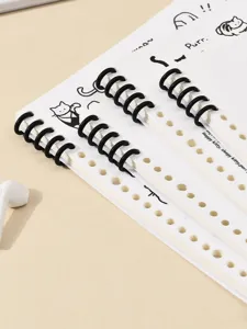 Gesegmenteerd notitieboekje met schattige kattenlijntekeningen en zwarte spiraalbinding.