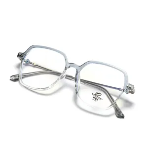 Close-up of transparent square glasses frame with anti-blue light and UV 400 lens sticker.