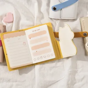 Leuke mini PU lederen planner notebook met katvormige omslagklep en to-do lijst pagina's.