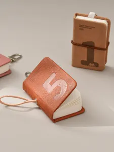 Mini pocket notebook with leather cover, cute number design and portable keychain lanyard.