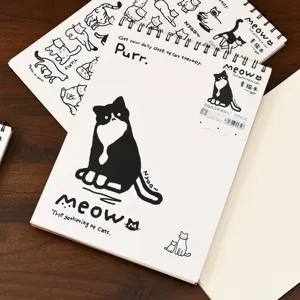 A4 spiral sketch book with cute black and white cat illustration cover for drawing art.