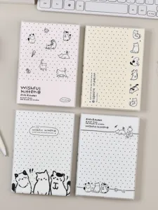 Vue détaillée du lot de carnets mignons pour chat avec des motifs à pois et de jolies illustrations.