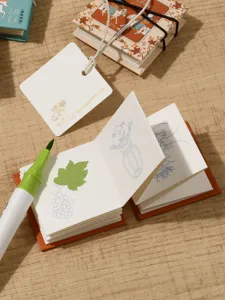 Mini blank coloring sketch book for children with marker pen and traditional design style.