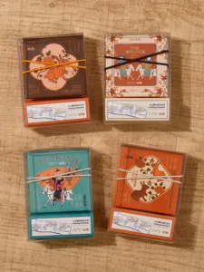 Close-up detail view of mini folding coloring notebooks with cute covers and secure binding.
