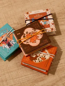 Detail view of Esani Chinese style sketchbooks featuring traditional Ming dynasty rabbit covers.