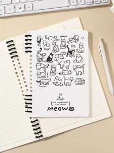 Gedetailleerd bovenaanzicht van schattige kattenillustratie B5 spiraalnotitieboek op bureau.