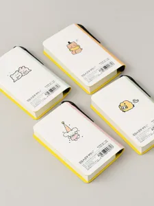 Detailed back view of four cute mini pocket notebooks with built-in pen holder slots