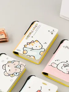 Detail of mini portable notebooks with cute animal illustrations and pen slots