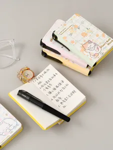 Cute pocket notebook set with sticky notes and pen for students daily planning and writing.