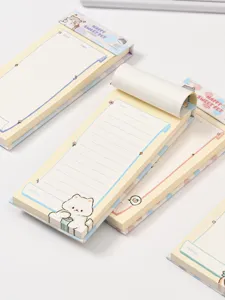 Cute cartoon tear-off memo pad detail shot, showing cute pet illustrations and neat line grids.