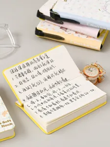 Portable mini pocket notebook with inspirational quotes and soft pastel cover design.