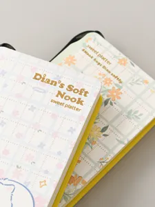 Cute plaid pocket notebook with floral cover, mini portable diary for students and notes.