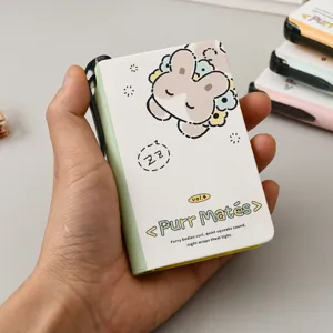 Mini portable pocket notebook featuring a cute cartoon animal design and a pen holder
