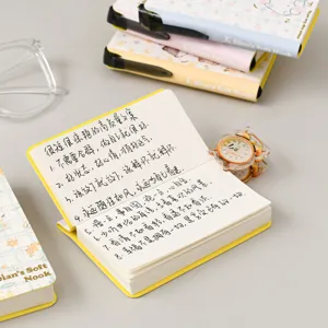 Portable pocket notebook with inspirational quotes, cute yellow design for students daily notes.