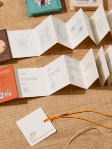 Mini folding coloring notebook with traditional patterns, creative art drawing book for kids.