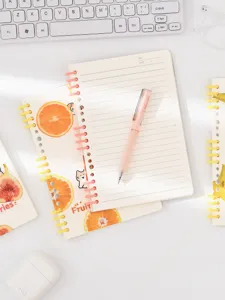 A5 loose-leaf notebook with segmented coil and fruit theme design, lined paper for daily journaling.