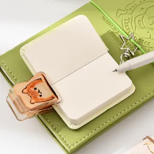 Portable mini notebook set with cute toast cat acrylic bookmark and pen for daily journaling.