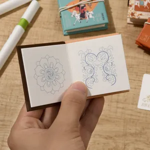 Mini doodle coloring memo book with cute botanical line art pages for kids sketching.