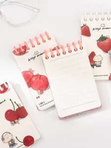 Lindo cuaderno de espiral de bolsillo A7 con ilustración de gato y fruta, páginas rayadas.