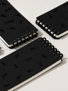 Black spiral notebook with cat pattern and pocket size design for daily writing and notes.