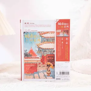 Hardcover vintage city travel journal notebook with magnetic buckle and colorful inner pages.