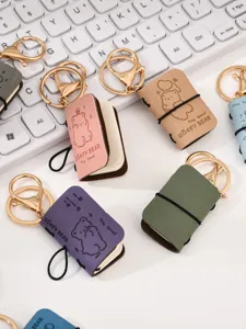 Grazioso mini portachiavi taccuino in pelle PU con ciondolo orsetto per zaino e borsa