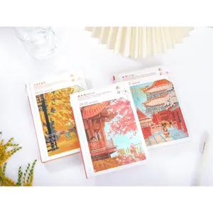 Detailed shot of city impression hardcover journals featuring scenic illustration covers and bookmarks.