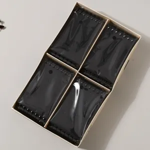 Cuaderno de bolsillo A7 negro espiral juego de cuatro en caja vista superior para oficina