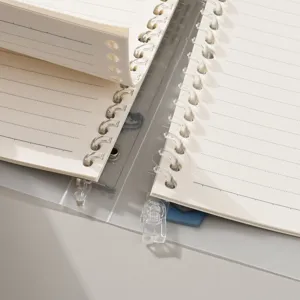 Detail view of loose-leaf binder rings and lined paper for B5 detachable notebook