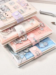 Close-up of stacked fluffy 64K notebooks featuring cute Cat's Sonata cartoon designs