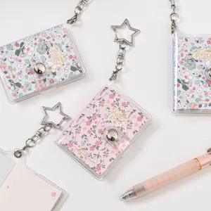 Mini transparent PVC notebook journal with star keychain, portable floral memo pad diary for gifts.