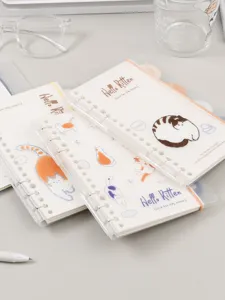 Detailed view of cute 6-hole loose-leaf notebook with adorable cat illustrations and durable binder rings.