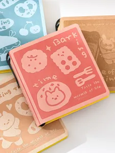 Cute embossed leather pocket notebook detail view with adorable cartoon cookie designs and warm text.