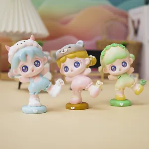 Detail of three cute cartoon animal-themed blind box figurines on a soft-lit background.