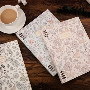 Detail view of B5 botanical pattern loose-leaf lined notebook with cute animal cover.