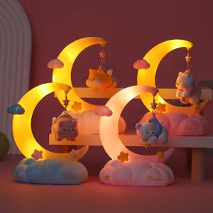 Detailed close-up view of four cute moon fairy tale night lights with warm yellow glow