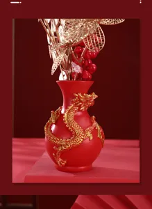 Close-up detail of the Year of the Dragon red ornament vase showing the golden dragon relief
