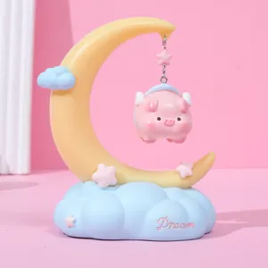Detailed view of moon fairy tale night light with cute hanging pig and Dream cloud base.