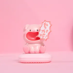 Close-up of cute pink pig resin aromatherapy box with Work Hard speech bubble detail